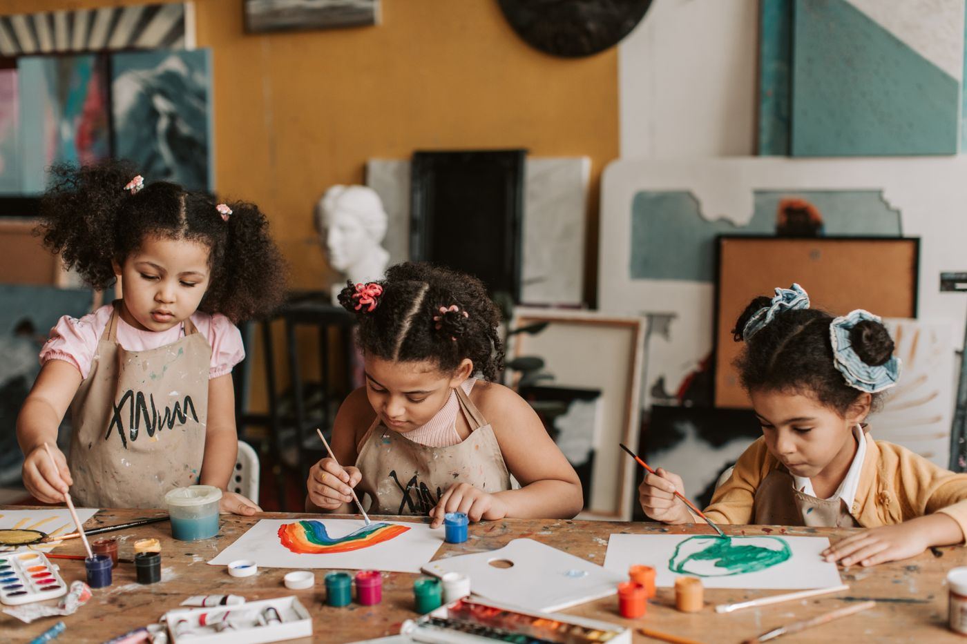 Children painting at a table